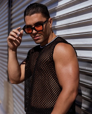 Man Wearing Black Tank Top and Black Framed Sunglasses