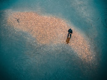 Man Wearing Black Top in Body of Water
