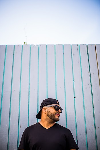 Man Wearing Black V-neck T-shirt and Sunglasses 