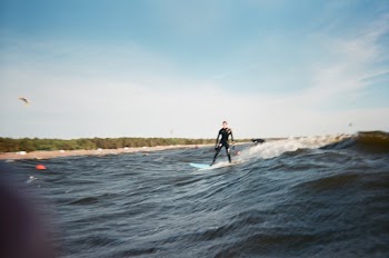 Man Wearing Black Wet Suit Surfing
