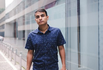Man Wearing Blue and White Polka-dot Button-up Shirt