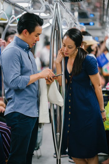 Man Wearing Blue Button-up Dress Shirt Holding Smartphone