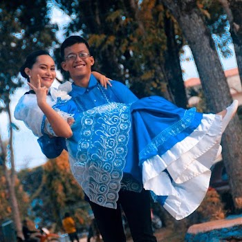 Man Wearing Blue Button-up Shirt Carrying Woman