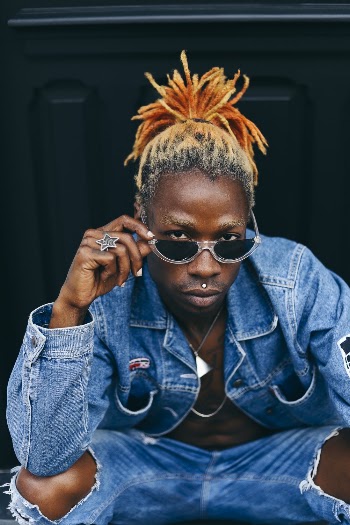 Man Wearing Blue Denim Jacket And Black Sunglasses