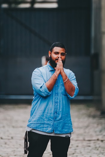 Man Wearing Blue Dress Shirt and Black Jeans