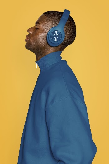 Man wearing blue headphones and | Free Photo - rawpixel