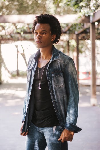 Man Wearing Blue Jacket and Denim Bottoms