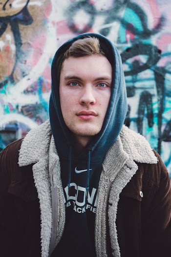 Man Wearing Blue Nike Pullover Hoodie