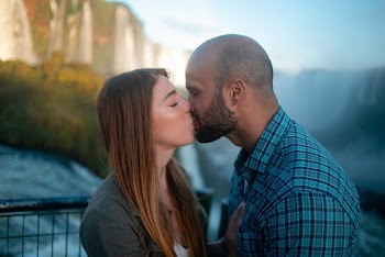 Man Wearing Blue Plaid Dress Shirt Kissing Woman Wearing Gray Jacket