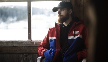 Man Wearing Blue, Red, and White Jacket