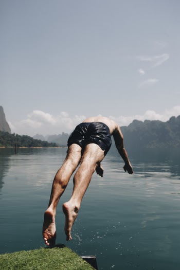 Man Wearing Blue Shorts