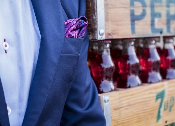Man Wearing Blue Suit Jacket With Pink Handkerchief In Pocket