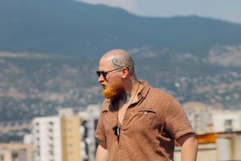 Man Wearing Brown Button-up Collared Shirt