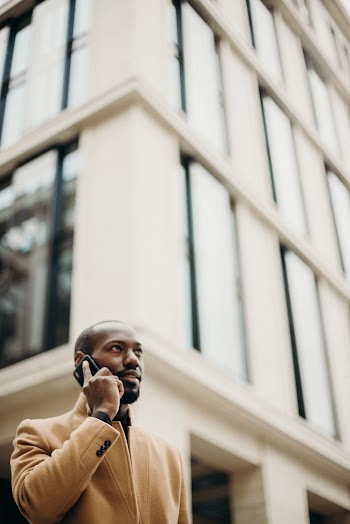 Man Wearing Brown Coat