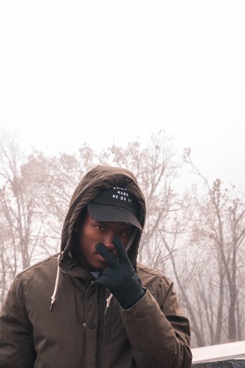 Man Wearing Brown Hooded Jacket