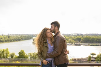Man Wearing Brown Leather Jacket Hugging Woman Wearing Brown Zip-up Leather Jacket