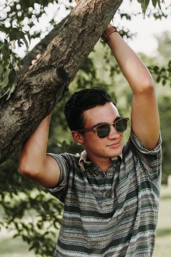 man wearing brown polo shirt