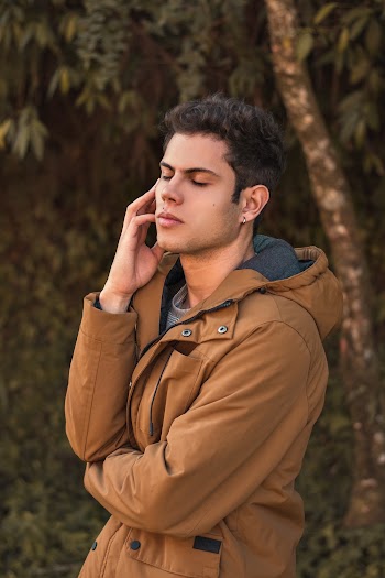 Man Wearing Brown Zip-up Jacket