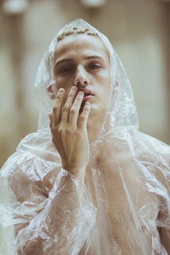 Man Wearing Clear Rain Coat