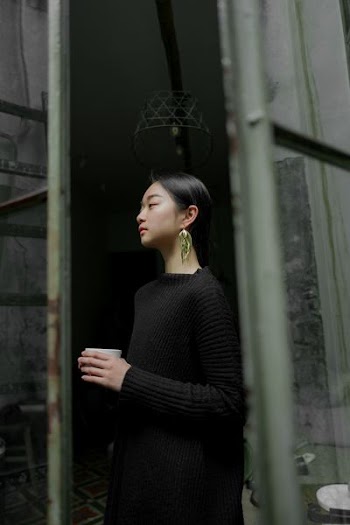 man wearing corduroy top near wall