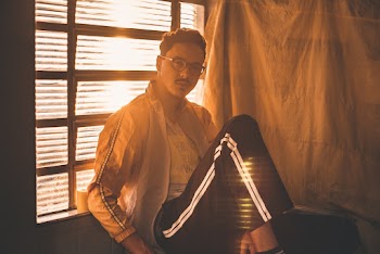 Man Wearing Eyeglasses Leaning Near Window
