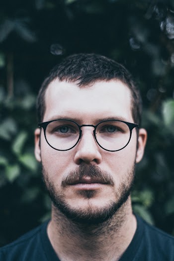 Man Wearing Eyeglasses Looking at the Camera during Day