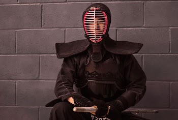 man wearing fencing safety gear set