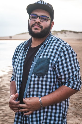 Man Wearing Gingham Shirt And Black Framed Eyeglasses