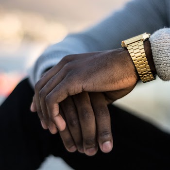 Man Wearing Gold-colored Wristwatch