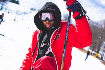 Man Wearing Googles and Holding Ski Pole