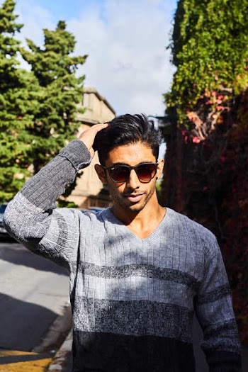 Man Wearing Gray and Black V-neck Sweater