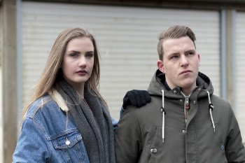 Man Wearing Gray Jacket Beside Woman Wearing Blue Denim Jacket