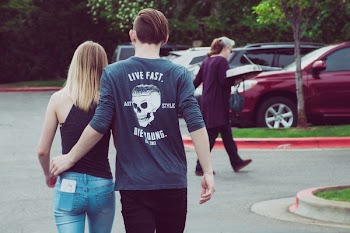 Man Wearing Gray Long-sleeved Shirt With Woman Wearing Black Camisole Top