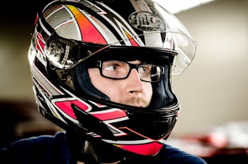 Man Wearing Gray, Red, and Black Full-face Helmet