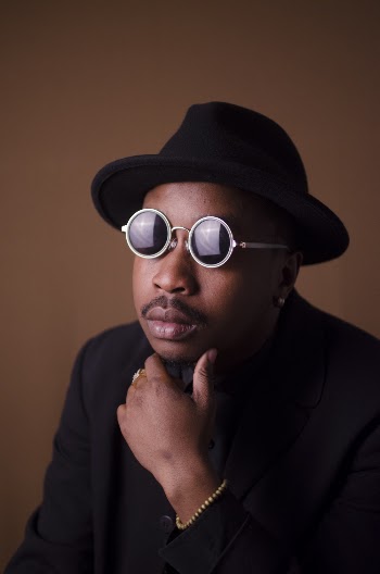 Man Wearing Gray Round Framed Sunglasses Holding Chin Close-up Photo