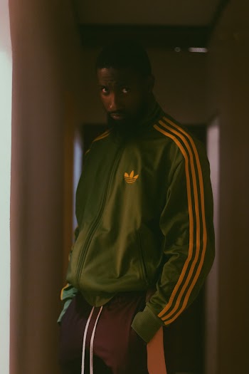 Man Wearing Green Adidas Jacket