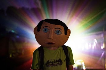 man wearing green t-shirt and backpack