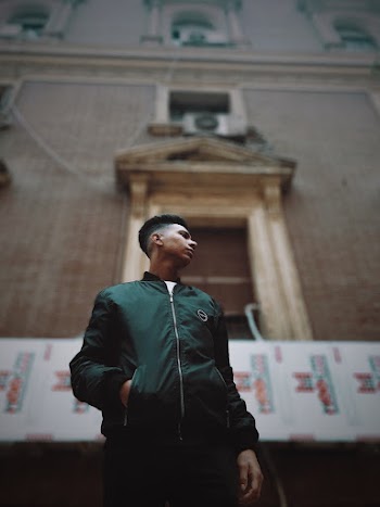 Man Wearing Green Zip-up Jacket
