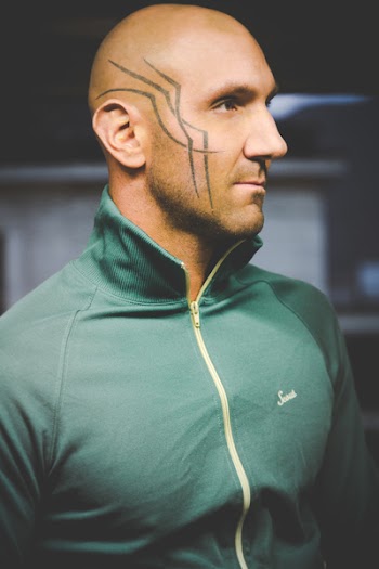 Man Wearing Green Zipped Jacket