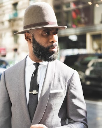 Man Wearing Grey Suit and Grey Hat