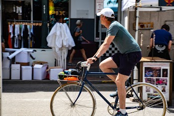 Man Wearing Grey T-shirt Riding Bicycle