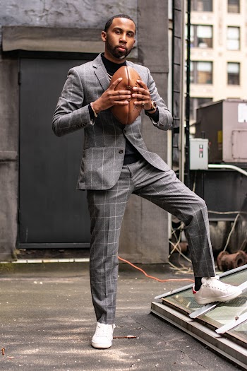 Man Wearing Grey Tuxedo Holding American Football