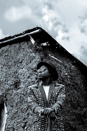 Man Wearing Hat and Suit Jacket in Grayscale Photography