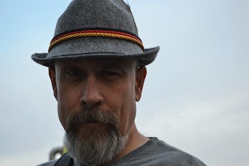 Man Wearing Hat Taking Selfie