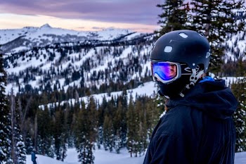 man wearing helmet and snow goggles
