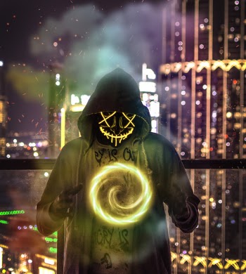 Man Wearing Hoodie Forming Chakra Wallpaper