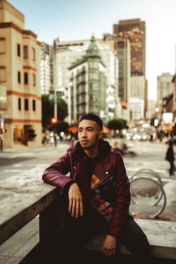 Man Wearing Maroon Leather Jacket