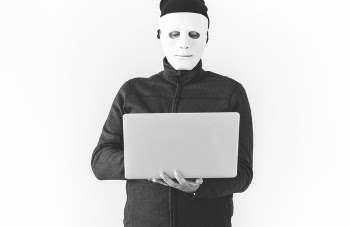 Man Wearing Mask Using Gray Laptop Computer