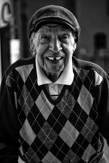 Man Wearing Newsboy Hat and Sweater