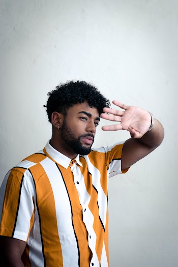 Man Wearing Orange and White Striped Polo Shirt